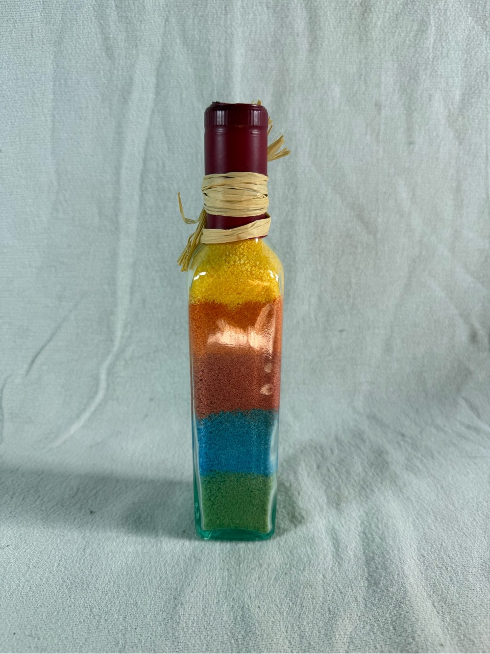 Rainbow Layered Colored Sand Décor in a Glass Wine Bottle